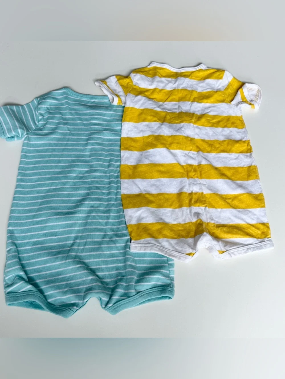 Two Carter's rompers- Striped Dino & Yellow Striped Baby 24m